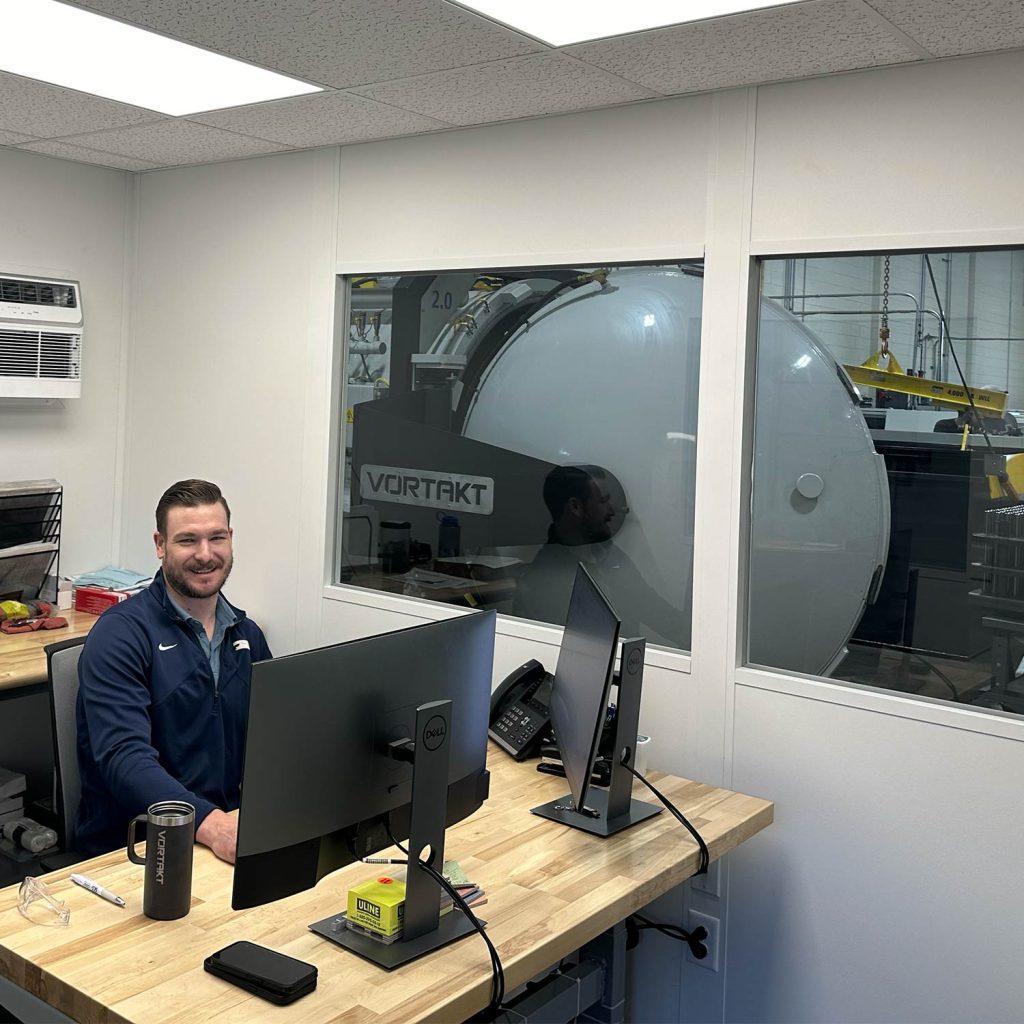 Marc Grischeau, Production Manager, working in shop office.